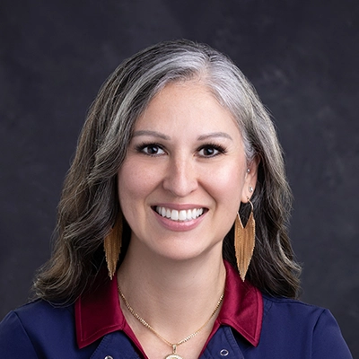 Dentist Stefanie Sunnes Smiling In Navy Jacket